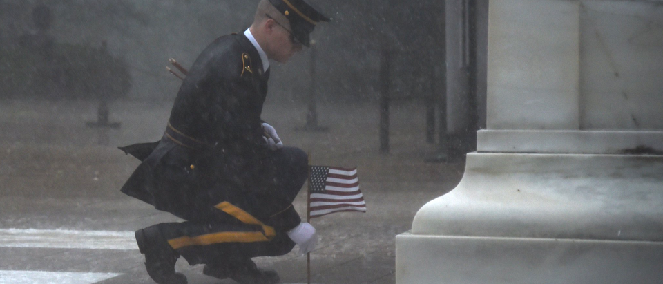 Member of the U.S. Army Old Guard places a flag before the Tomb of the Unknowns. Photo courtesy of the U.S. Army