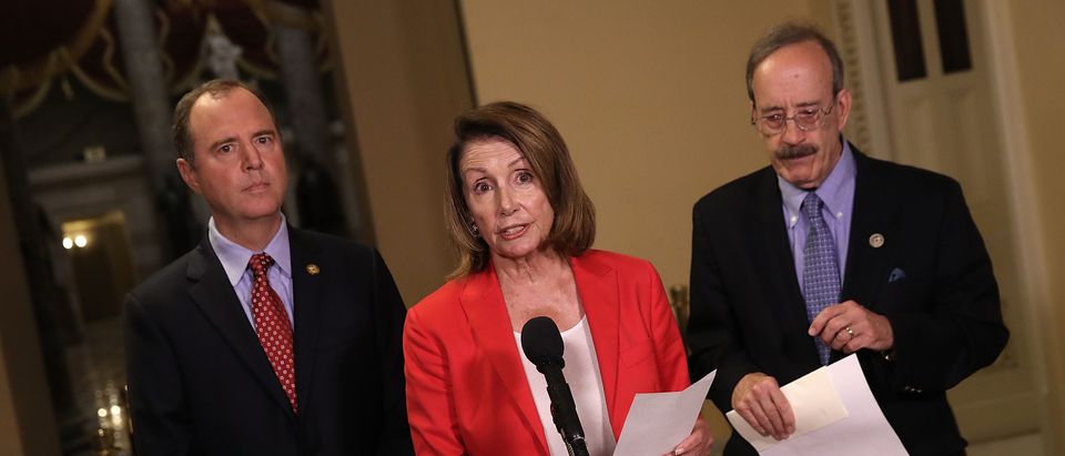House Minority Leader Nancy Pelosi speaks at a press conference at the U.S. Capitol July 23, 2018 in Washington, DC. Pelosi, Rep. Adam Schiff (L) and Rep. Eliot Engel (R) have introduced a resolution condemning U.S. President Donald Trump's statements during the recent summit with Russian President Vladimir Putin in Helsinki. (Photo by Win McNamee/Getty Images)
