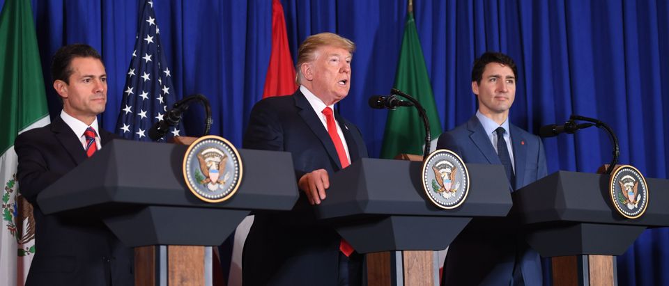 (L to R) Mexican President Enrique Pena Nieto, US President Donald Trump and Canadian Prime Minister Justin Trudeau deliver a statement on the signing of a new free trade agreement in Buenos Aires, on November 30, 2018 (SAUL LOEB / AFP) (Photo credit should read SAUL LOEB/AFP/Getty Images)