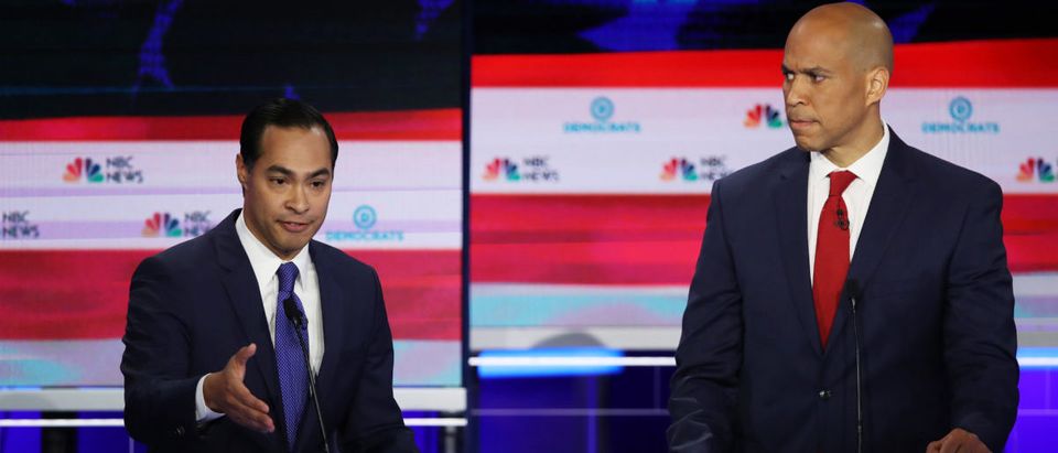 Former housing secretary Julian Castro and Sen. Cory Booker (D-NJ) take part in the first night of the Democratic presidential debate on June 26, 2019 in Miami, Florida. (Photo by Joe Raedle/Getty Images)
