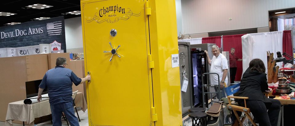 INDIANAPOLIS, INDIANA - APRIL 25: Workers with Champion Safe Company set up their display at the 148th NRA Annual Meetings &amp; Exhibits, including their Big Yellow which Champion bills as the world's largest gun safe on April 25, 2019 in Indianapolis, Indiana. The convention, which runs through Sunday, features more than 800 exhibitors as wells as guest speakers, including U.S. President Donald Trump and Vice President Mike Pence. (Photo by Scott Olson/Getty Images)