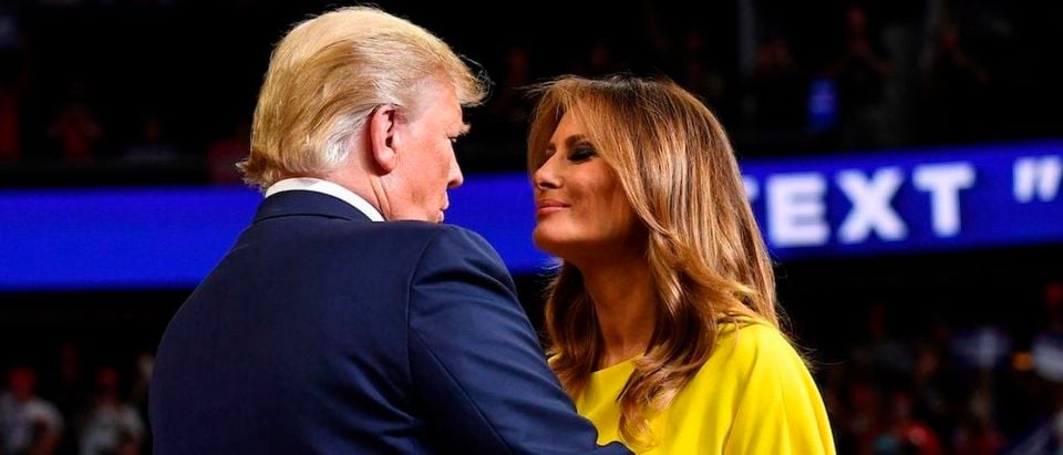 US President Donald Trump greets First Lady Melania Trump as he takes the stage for the official launch of the Trump 2020 campaign at the Amway Center in Orlando, Florida on June 18, 2019. - Trump kicks off his reelection campaign at what promised to be a rollicking evening rally in Orlando. (Photo credit: MANDEL NGAN/AFP/Getty Images)
