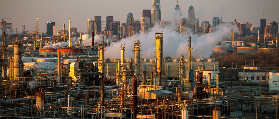 FILE PHOTO: The Philadelphia Energy Solutions oil refinery owned by The Carlyle Group is seen at sunset in front of the Philadelphia skyline March 24, 2014. Picture taken March 24, 2014. REUTERS/David M. Parrott/File Photo