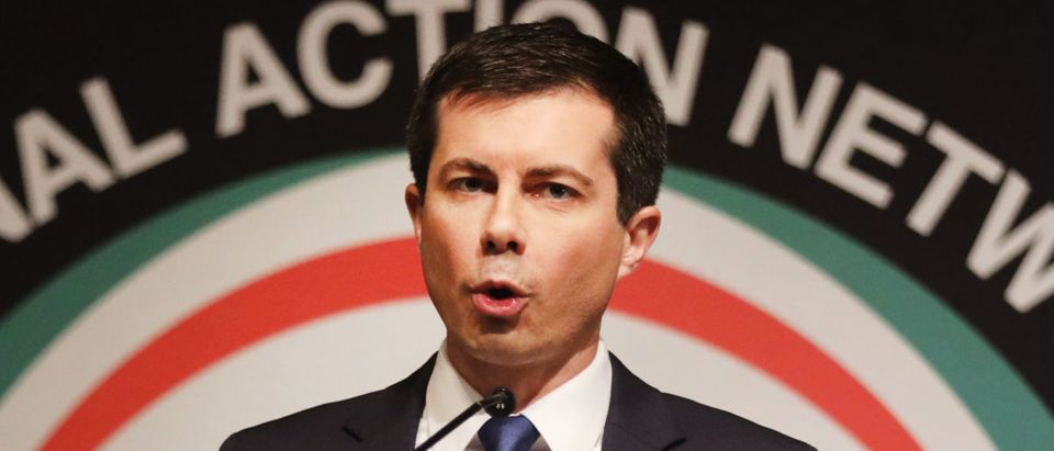 With Rev. Al Sharpton looking on, Democratic presidential hopeful South Bend, Indiana, Mayor Pete Buttigieg speaks at the National Action Network's annual convention on April 4, 2019 in New York City. (Photo by Spencer Platt/Getty Images)