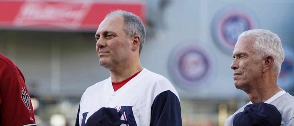 House Majority Whip Steve Scalise (R-LA) listens to the National Anthem prior to the annual Congressional Baseball game at Nationals Park in Washington, U.S., June 14, 2018. REUTERS/Toya Sarno Jordan