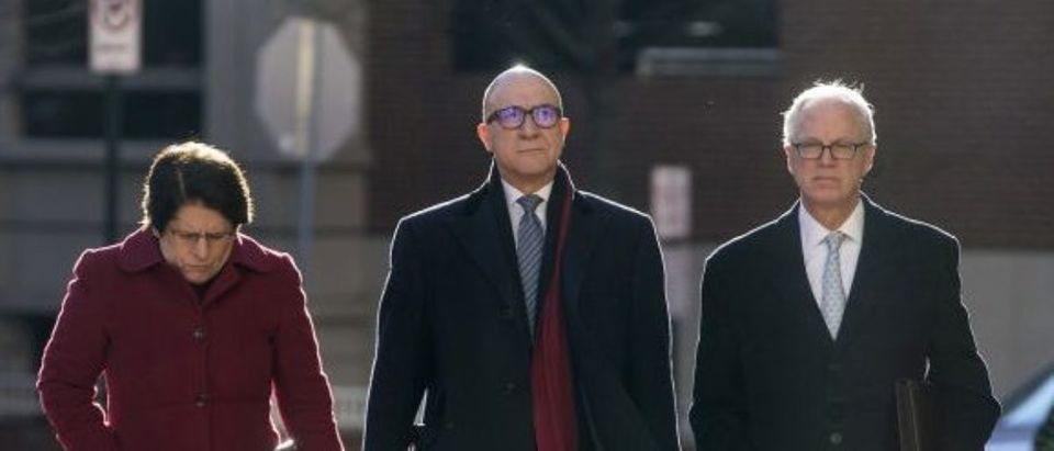 Bijan Rafiekian, also known as Bijan Kian, center, arrives at the U.S. District Court in Alexandria, Virginia, U.S., on Tuesday, Dec. 18. 2018. Kian and Kamil Ekim Alptekin, associates of former National Security Adviser Michael Flynn, were accused of helping the government of President Recep Tayyip Erdogan retaliate against a political opponent, and then concealing the government's involvement. Photographer: Zach Gibson/Bloomberg via Getty Images