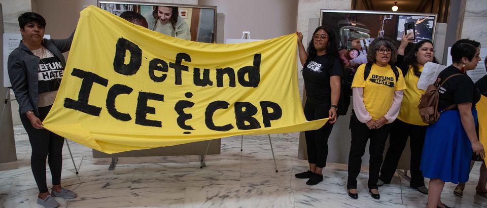 People rally to demand cuts to funding for US Immigration and Customs Enforcement (ICE) and Customs and Border Protection (CBP) at the Russell Senate Office Building on Capitol Hill in Washington, DC, on June 25, 2019. (Photo by NICHOLAS KAMM / AFP) (Photo credit should read NICHOLAS KAMM/AFP/Getty Images)