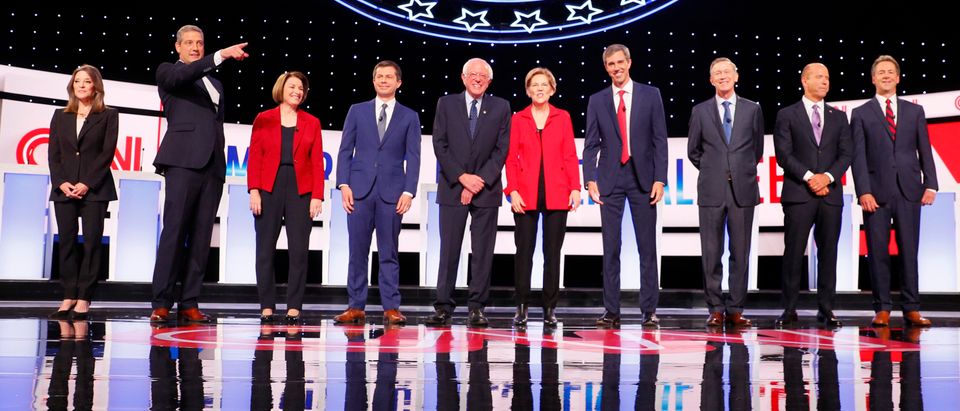 Democratic 2020 U.S. presidential candidates pose before the start on the first night of the second 2020 Democratic U.S. presidential debate in Detroit