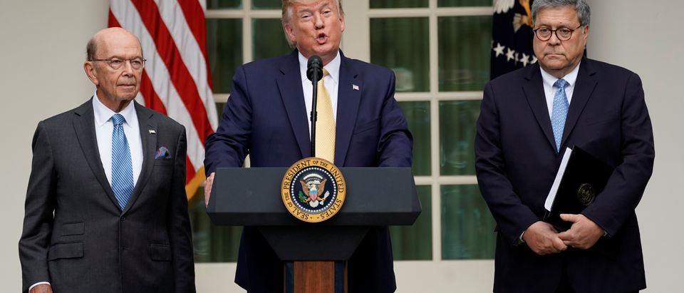 U.S. President Donald Trump stands between Commerce Secretary Wilbur Ross and Attorney General Bill Barr to announce his administration's effort to gain citizenship data during the 2020 census at an event in the Rose Garden of the White House in Washington, U.S., July 11, 2019. REUTERS/Kevin Lamarque
