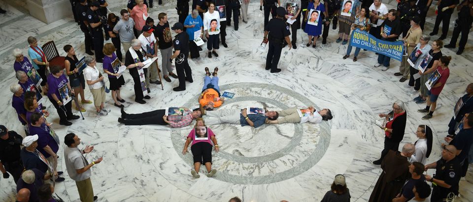 Members of the Franciscan Action Network holds a prayer vigil to "end the abuse and detention of children at the Russell Senate Office Building on Capitol Hill in Washington, D.C., on July 18, 2019. (Photo: BRENDAN SMIALOWSKI/AFP/Getty Images)