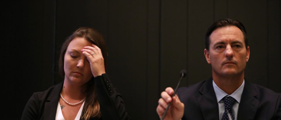 Courtney Wild, who claims she was abused by Jeffrey Epstein when she was a minor, sits with members of her legal team, including Brad Edwards (R) and Stan Pottinger at a news conference July 16, 2019 in New York City. (Photo by Spencer Platt/Getty Images)