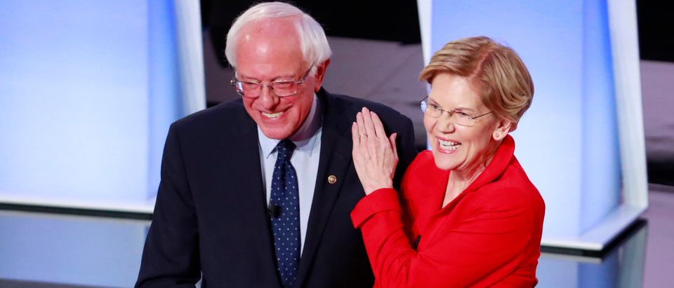 U.S. Senators Sanders and Warren shake hands before the start of the first night of the second 2020 Democratic U.S. presidential debate in Detroit, Michigan, U.S.