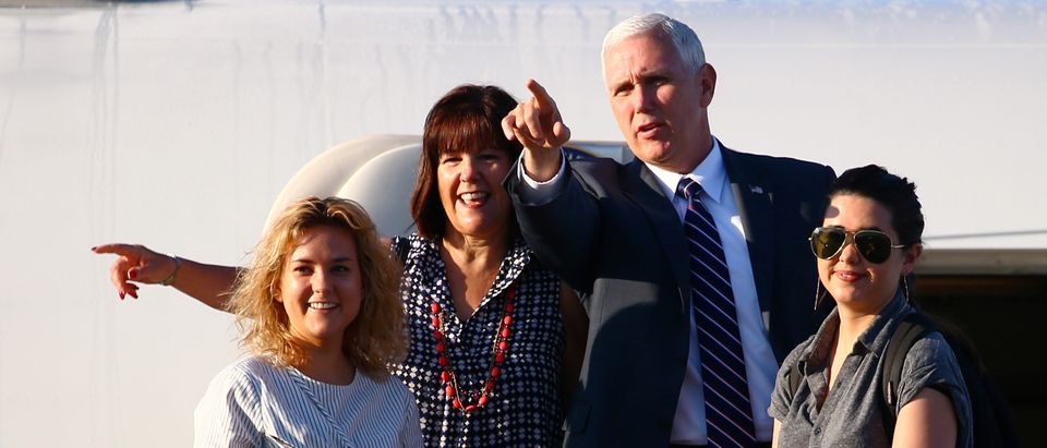 U.S. Vice President Mike Pence (2nd R), his wife Karen (2nd L) and their daughters Charlotte (L) and Audrey stand on the steps of Air Force Two as they depart Sydney, Australia, April 24, 2017. REUTERS/David Gray