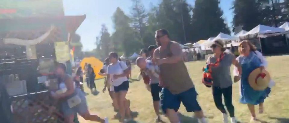 People run as an active shooter was reported at the Gilroy Garlic Festival, south of San Jose, California, U.S., July 28, 2019 in this still image taken from a social media video. Courtesy of Twitter @wavyia/Social Media via Reuters