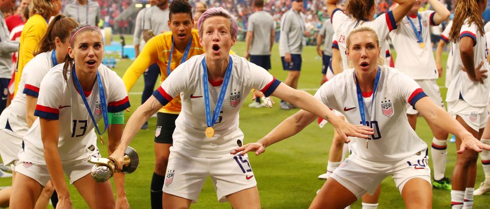 Women's World Cup Final - United States v Netherlands - Groupama Stadium, Lyon, France - July 7, 2019 Megan Rapinoe of the U.S. celebrates with the trophy with team mates after winning the Women's World Cup REUTERS/Denis Balibouse