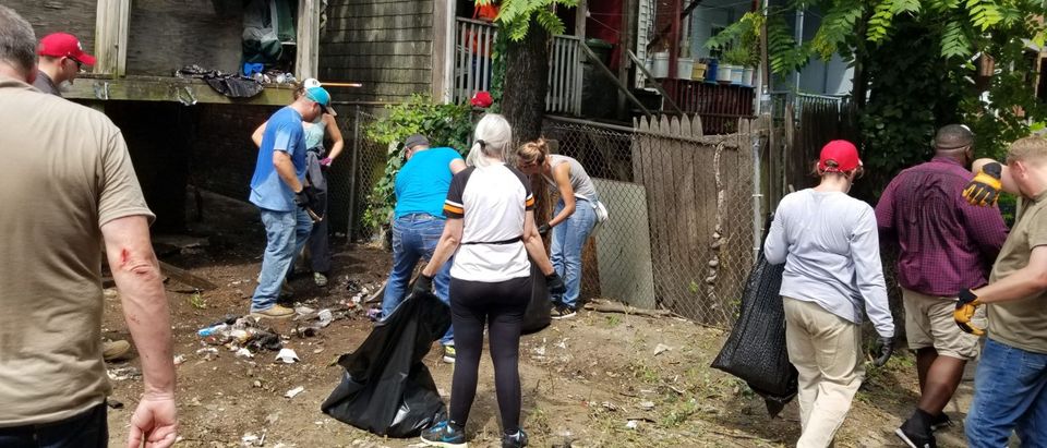 Volunteers clean up trash in Northwest Baltimore August 5 in a Baltimore clean-up organized by Scott Presler. (Photo courtesy of Spenser Weidman)