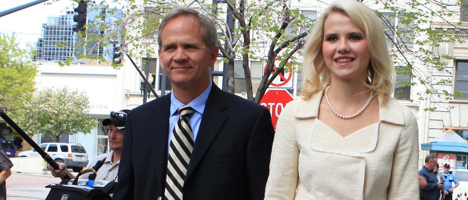 Elizabeth Smart and her father Ed Smart leave the Federal Courthouse after addressing her kidnapper, Brian David Mitchell, during his sentencing in Salt Lake City, Utah, May 25, 2011. The homeless street preacher convicted of kidnapping Smart was sentenced on Wednesday to life in prison after Smart told him that he would be held responsible for his actions "in this life or the next." REUTERS/Michael Brandy