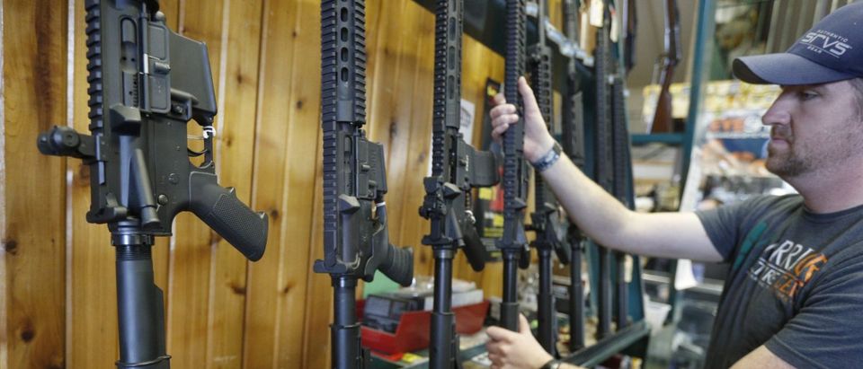OREM, UT - FEBRUARY 15: Dordon Brack, pulls a semi-automatic AR-15 off the rack, that is for sale at Good Guys Guns &amp; Range on February 15, 2018 in Orem, Utah. An AR-15 was used in the Marjory Stoneman Douglas High School shooting in Parkland, Florida. (Photo by George Frey/Getty Images)