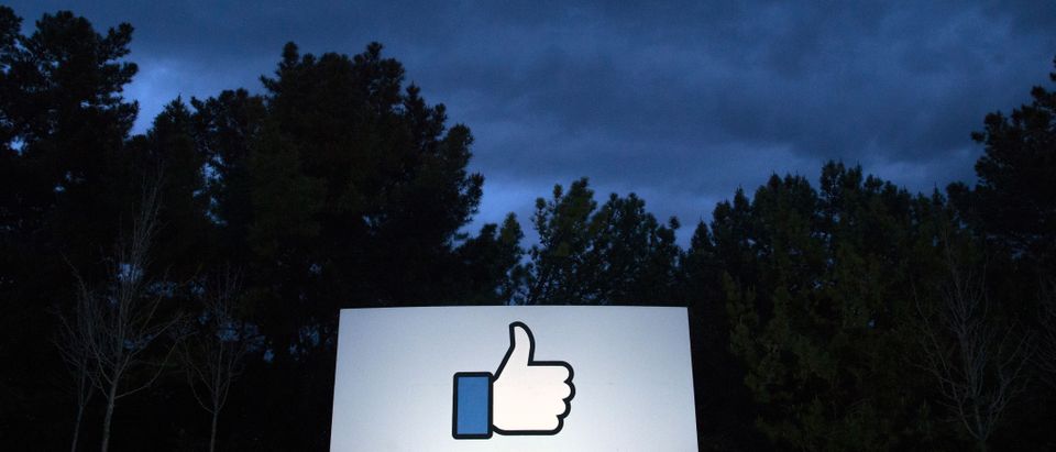 A lit sign is seen at the entrance to Facebook's corporate headquarters location in Menlo Park, California on March 21, 2018. (JOSH EDELSON/AFP/Getty Images)