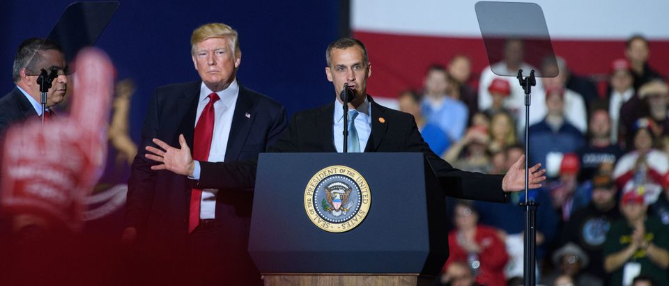 Former Trump Campaign manager Corey Lewandowski speaks as US President Donald Trump looks on during a rally at Total Sports Park in Washington, Michigan on April 28, 2018. (Photo by MANDEL NGAN / AFP) (Photo credit should read MANDEL NGAN/AFP/Getty Images)