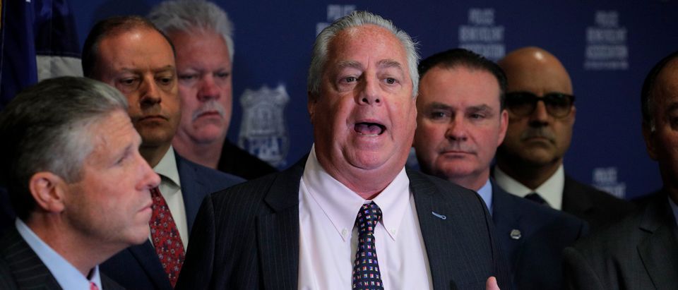 Attorney Stuart London speaks as Patrick Lynch, president of the Patrolmen's Benevolent Association of New York City, looks on during a news conference after a New York Police Department (NYPD) disciplinary judge recommended the firing of officer Daniel Pantaleo. (REUTERS/Brendan McDermid)