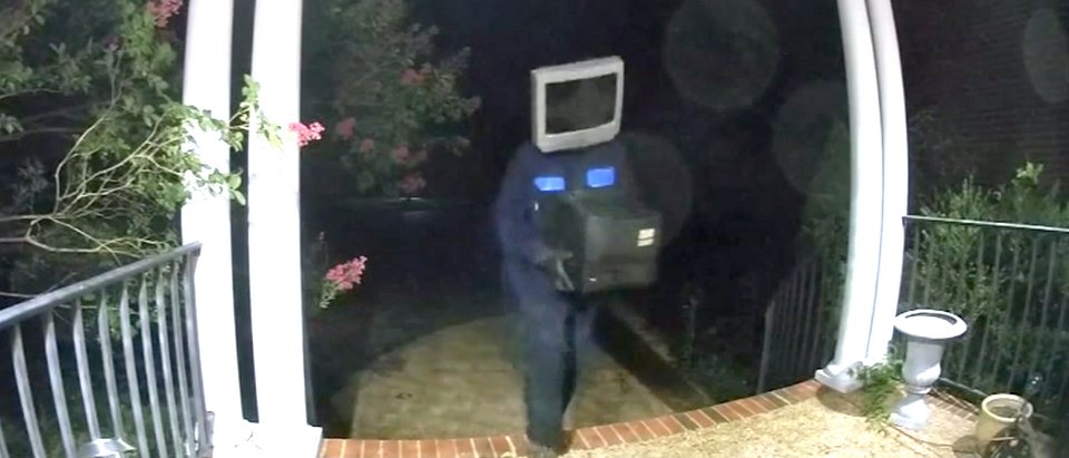 Man wearing TV on head caught on camera leaving old TVs on Virginia front porches