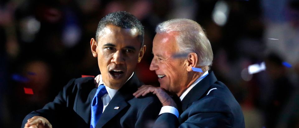 U.S. President Barack Obama gestures with Vice President Joe Biden after his election night victory speech in Chicago, November 6, 2012. REUTERS/Larry Downing