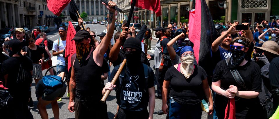 Members of an anti-fascist or Antifa group march as the Alt-Right movement gathers for a "Demand Free Speech" rally in Washington, DC, on July 6, 2019. (ANDREW CABALLERO-REYNOLDS/AFP/Getty Images)
