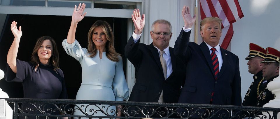 U.S. President Donald Trump and first lady Melania Trump, Australian Prime Minister Scott Morrison and his wife Jennifer Morrison wave from the Truman Balcony during an arrival ceremony at the White House September 20, 2019 in Washington, DC. Prime Minister Morrison will participate in an Oval Office meeting, a joint news conference, and a state dinner during his official visit in Washington. (Photo by Alex Wong/Getty Images)
