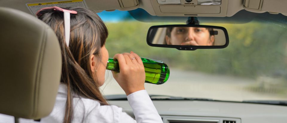 Woman driving drunk. (Shutterstock/Oleg Mikhaylov)