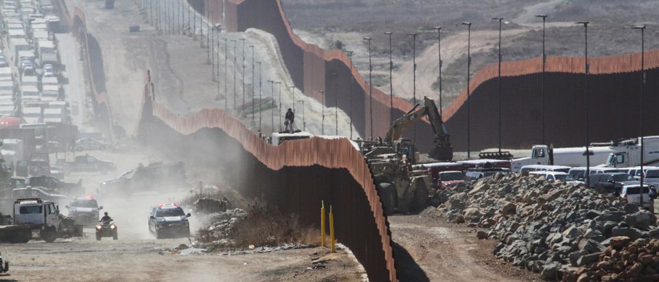 A general view shows Mexican security forces keeping watch at the border fence between Mexico and the United States, ahead of the visit of U.S. President Donald Trump to a section of the border wall in Otay Mesa, California, as pictured from Tijuana