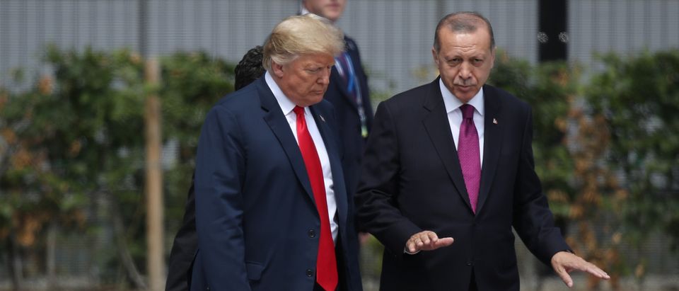 U.S. President Donald Trump (L) and Turkish President Recep Tayyip Erdogan attend the opening ceremony at the 2018 NATO Summit at NATO headquarters on July 11, 2018 in Brussels, Belgium. (Photo by Sean Gallup/Getty Images)