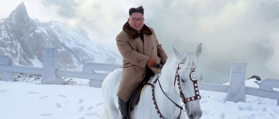 North Korean leader Kim Jong Un rides a horse during snowfall in Mount Paektu