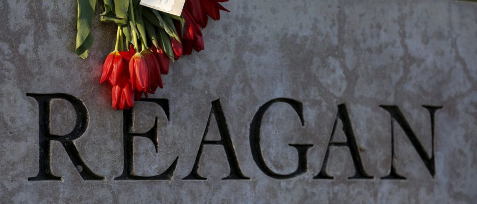 Flowers are placed on a sign at The Ronald Reagan Presidential Library in honor of former First Lady Nancy Reagan, who died at the age of 94, in Simi Valley, California