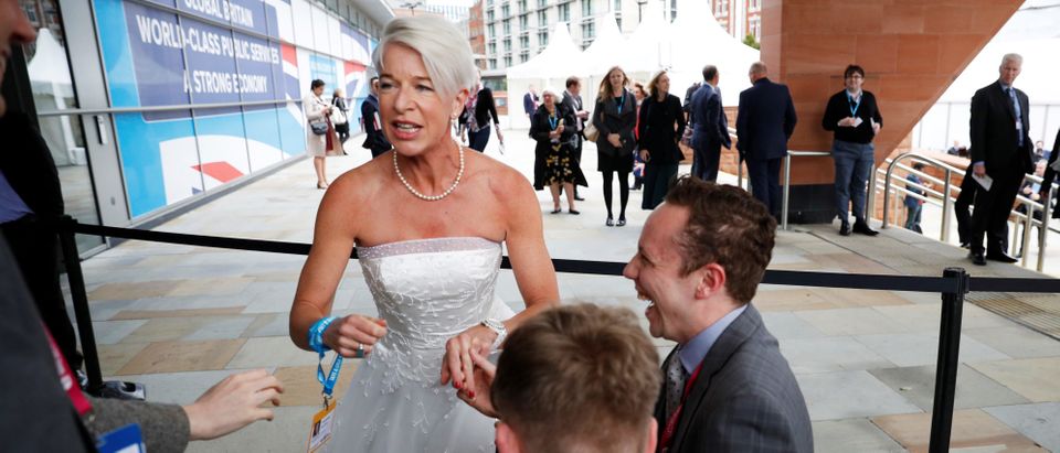 Newspaper columnist Katie Hopkins arrives dressed in a wedding dress at the Conservative Party's conference in Manchester