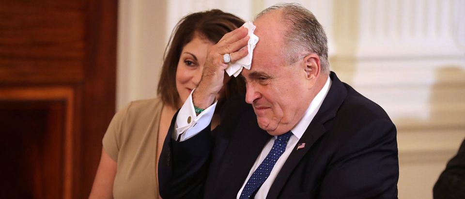 Former New York City Mayor Rudy Giuliani (R) and Jennifer LeBlanc arrive in the East Room before U.S. President Donald Trump introduces Judge Brett Kavanaugh as his nominee to the United States Supreme Court at the White House July 9, 2018 in Washington, DC. (Chip Somodevilla/Getty Images)