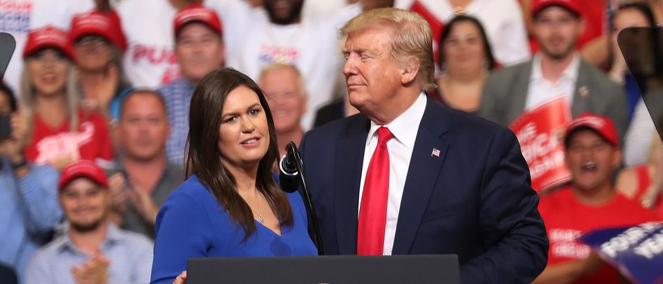 U.S. President Donald Trump stands with Sarah Huckabee Sanders during his rally where he announced his candidacy for a second presidential term. (Joe Raedle/Getty Images)