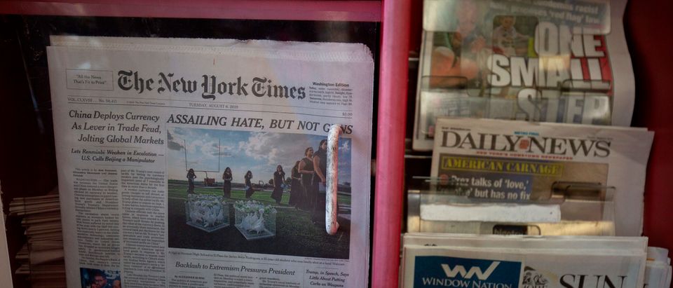 The front pages of The New York Times, New York Post, New York Daily News and Baltimore Sun newspapers are seen at a convenience store in Washington, DC, on August 6, 2019. (ALASTAIR PIKE/AFP via Getty Images)