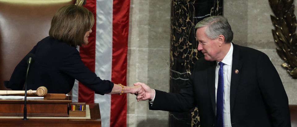 WASHINGTON, DC - DECEMBER 18: Speaker of the House Nancy Pelosi (D-CA) and Rep. Mark Meadows (R-NC) shake hands as the House of Representatives votes on the second article of impeachment of US President Donald Trump at in the House Chamber at the US Capitol Building on December 18, 2019 in Washington, DC. The U.S. House of Representatives voted to successfully pass two articles of impeachment against President Donald Trump on charges of abuse of power and obstruction of Congress. (Photo by Chip Somodevilla/Getty Images)