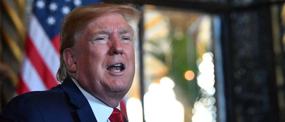 US President Donald Trump answers questions from reporters after making a video call to the troops stationed worldwide at the Mar-a-Lago estate in Palm Beach Florida, on December 24, 2019. (Photo by NICHOLAS KAMM/AFP via Getty Images)