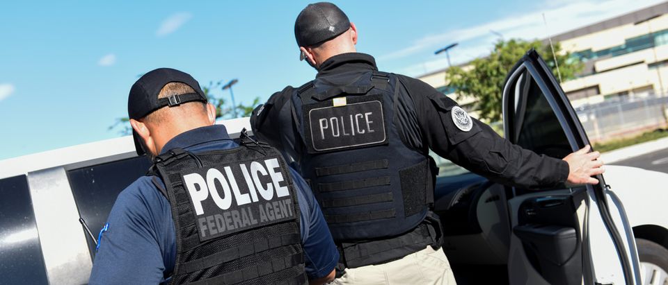 ICE Enforcement and Removal Operations (ERO) officers transfer an unauthorized immigrant with a criminal record during an Immigration and Customs Enforcement (ICE) operation in San Jose, California, U.S., Sept. 25, 2019. REUTERS/Kate Munsch