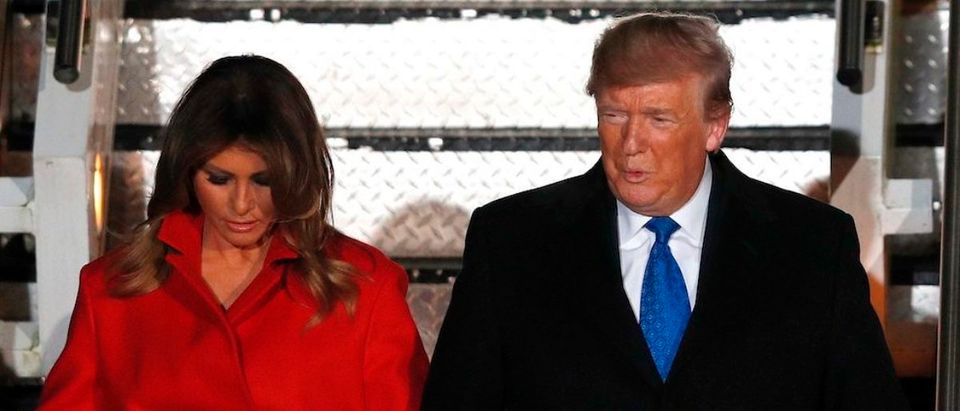 US President Donald Trump (R) and US First Lady Melania Trump disembark Air Force One after landing at Stansted Airport, northeast of London on December 2, 2019, as they arrive ahead of the upcoming NATO alliance summit. - NATO marks its 70th birthday at a summit next week but the celebration could well turn into an arena of political combat between the alliance's feuding leaders. Heads of state and government will descend on London Tuesday bracing for a scrap over spending and how to deal with Russia, in a huge test of unity within NATO -- billed by its own officials as the "most successful alliance in history". (Photo by ADRIAN DENNIS/AFP via Getty Images)