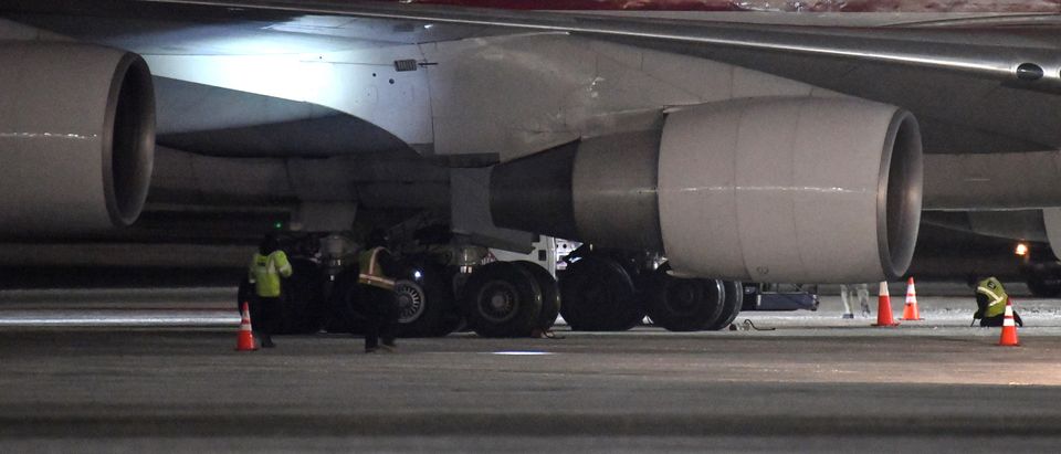 A Boeing 747-4B5(F), on a charter flight from Wuhan, China, is inspected following its arrival at Ted Stevens Anchorage International Airport on January 28, 2020 in Anchorage, Alaska. The U.S. government chartered the plane to evacuate U.S. citizens and diplomats from the U.S. consulate in Wuhan, China where the coronavirus outbreak began. (Photo by Lance King/Getty Images)
