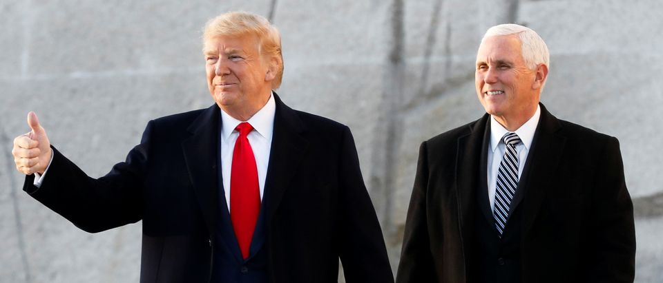 U.S. President Donald Trump gestures next to Vice President Mike Pence during a visit to the Martin Luther King Jr. Memorial in Washington, U.S. January 20, 2020. (REUTERS/Yuri Gripas)