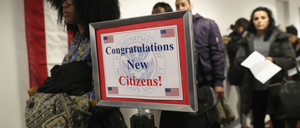 Immigrants wait in line to become U.S. citizens at a naturalization ceremony on Feb. 2, 2018 in New York City. U.S. Citizenship and Immigration Services (USCIS) swore in 128 immigrants from 42 different countries during the ceremony at the downtown Manhattan Federal Building. (Photo by John Moore/Getty Images)