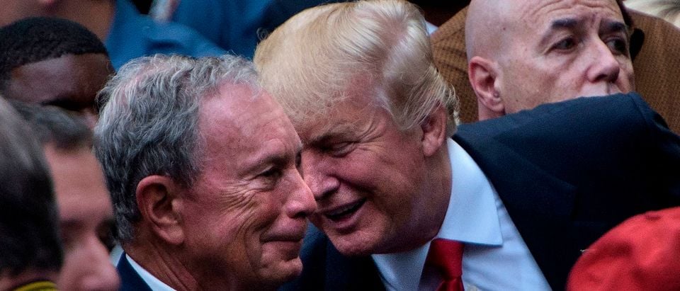 US Republican presidential nominee Donald Trump speaks to former New York City Mayor Michael Bloomberg during a memorial service at the National 9/11 Memorial September 11, 2016 in New York. - The United States on Sunday commemorated the 15th anniversary of the 9/11 attacks. (Photo by Brendan SMIALOWSKI / AFP)