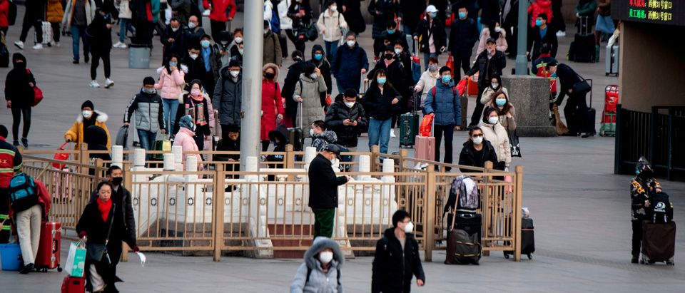 Passengers wearing facemasks arrive from different provinces at the Beijing Railway Station on February 1, 2020. - China faced deepening isolation over its coronavirus epidemic as the death toll soared to 259, with the United States and Australia leading a growing list of nations to impose extraordinary Chinese travel bans. (Photo by NOEL CELIS/AFP via Getty Images)