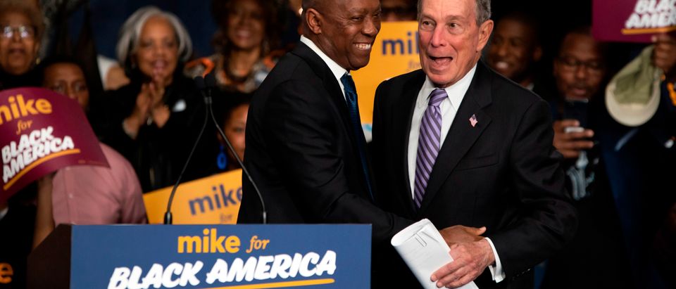 Democratic presidential hopeful Mike Bloomberg (R) arrives to speak at the "Mike for Black America Launch Celebration" at the Buffalo Soldier National Museum in Houston, Texas, on February 13, 2020. (MARK FELIX/AFP /AFP via Getty Images)