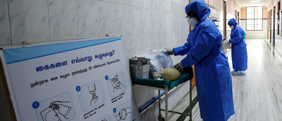 Medical staff with protective clothing are seen inside a ward specialised in receiving any person who may have been infected with coronavirus, at the Rajiv Ghandhi Government General hospital in Chennai
