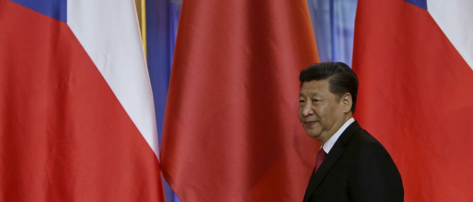 FILE PHOTO: Chinese President Xi Jinping leaves after a news conference at Prague Castle in Prague